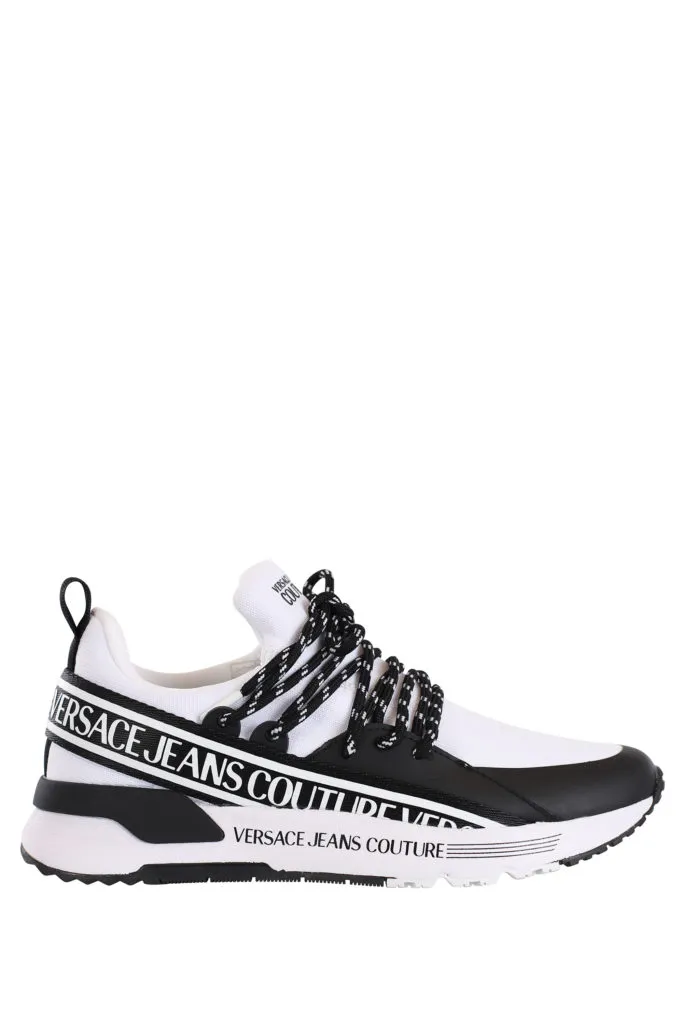 Zapatillas blancas con cordones cruzados y logo en cinta